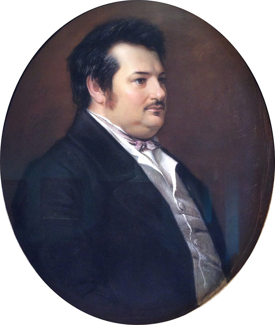 Portrait ovale d'un homme de profil, veste sombre et gilet gris