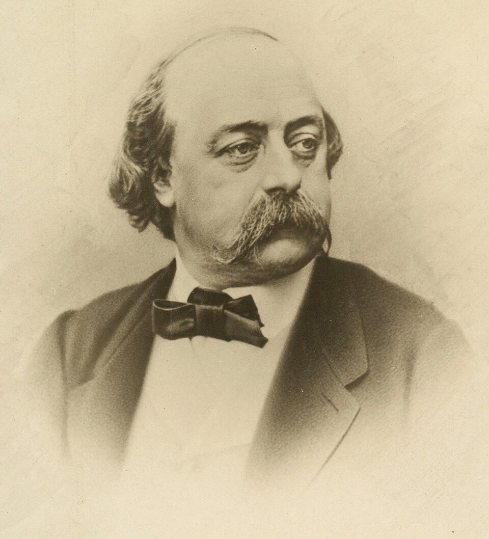 Portrait sépia d'un homme chauve aux cheveux longs sur les côtés, à grosses moustaches tombantes, en nœud papillon