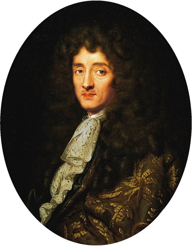 Portrait ovale d'un homme à longue perruque brune bouclée, jabot de dentelle et habit brodé d'or